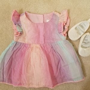 Shimmery mermaid color dress.